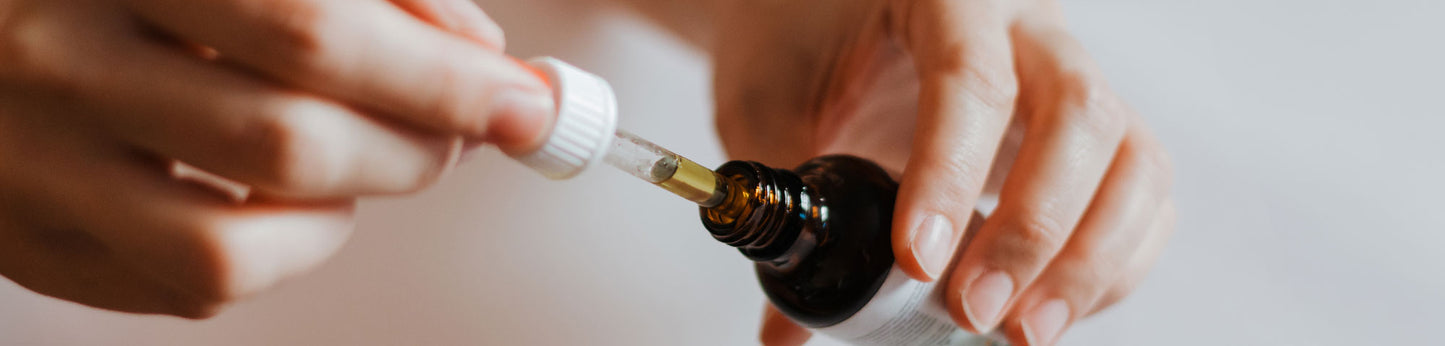 Skincare Banner - Hands holding a vial